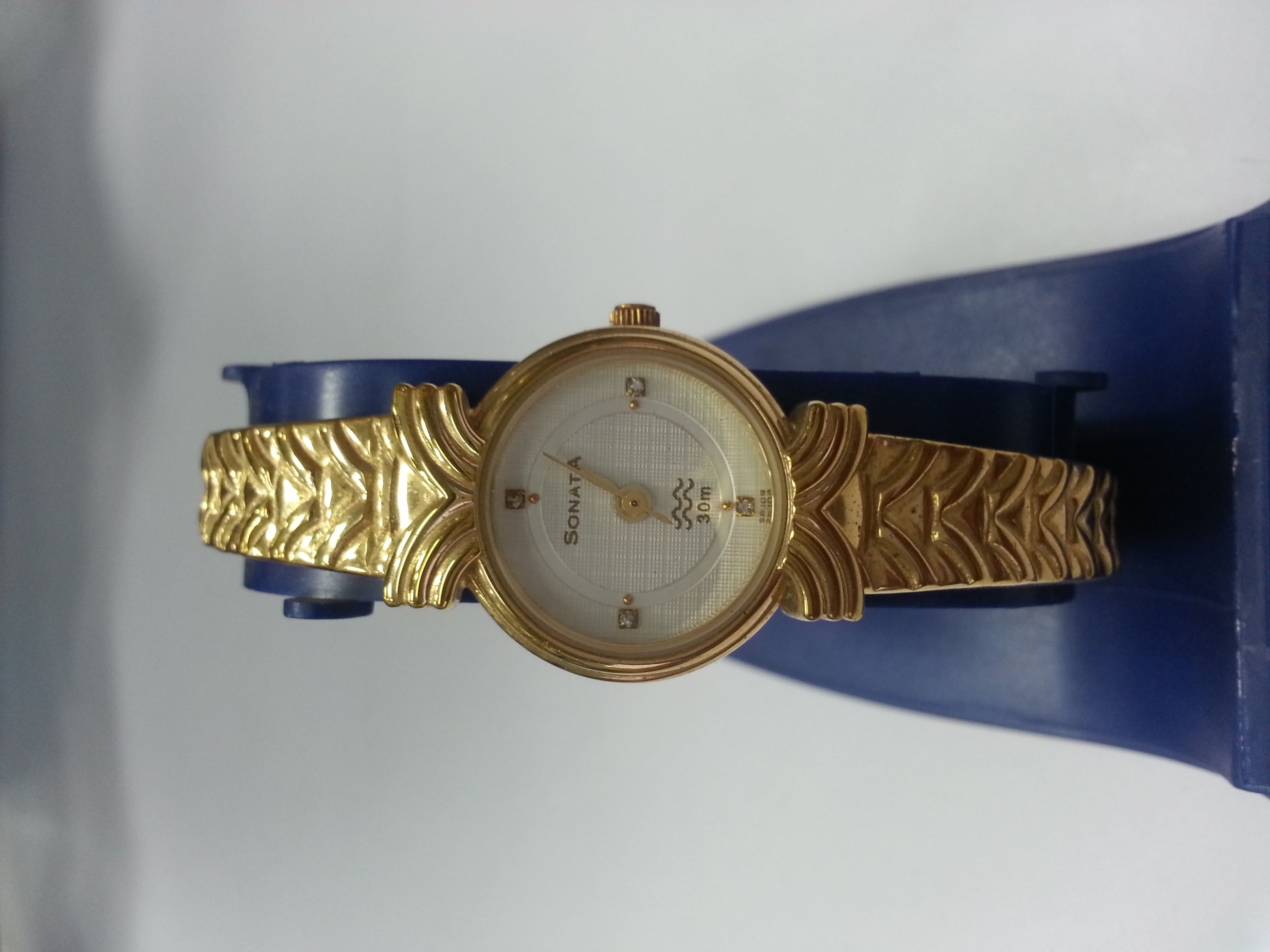 Sonata ladies golden chain watch